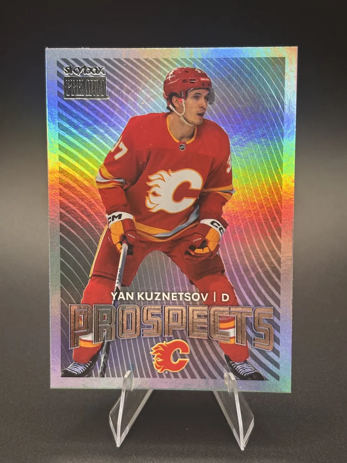 2024-25 Skybox Metal Universe Prospects Yan Kuznetsov, rainbow foil front, in a clear stand